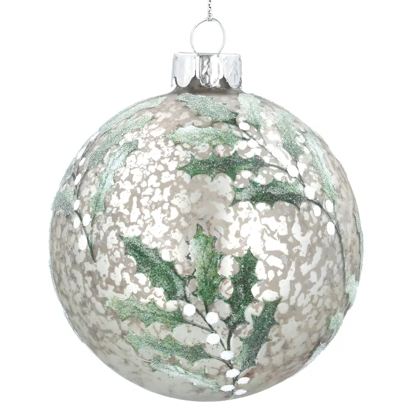 Bola de cristal envejecida y dibujo de acebo