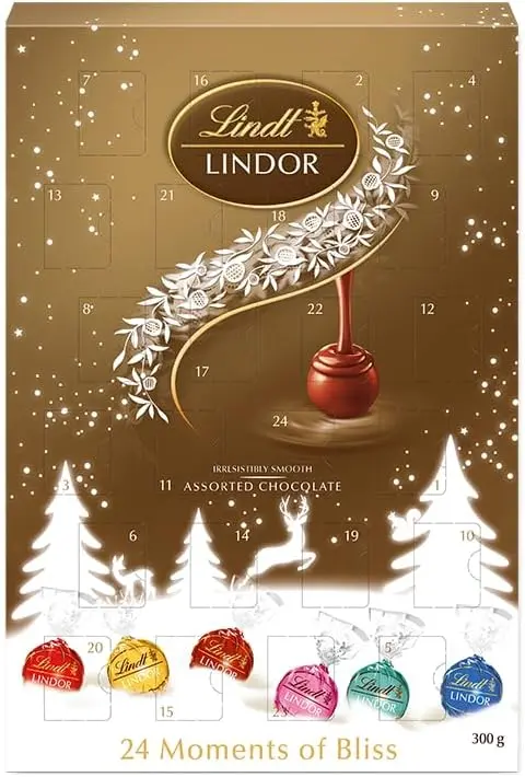 Calendario de Adviento Lindt LINDOR con 300g de bombones surtidos. Un viaje de sabor con 24 sorpresas de chocolate con leche, negro, blanco, avellana, fresa y coco.
