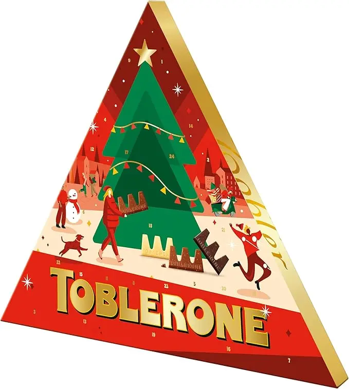 Calendario de Adviento Toblerone con 200g de chocolate suizo. Incluye una deliciosa selección de mini chocolatinas con miel y almendras para una Navidad triangularmente perfecta.