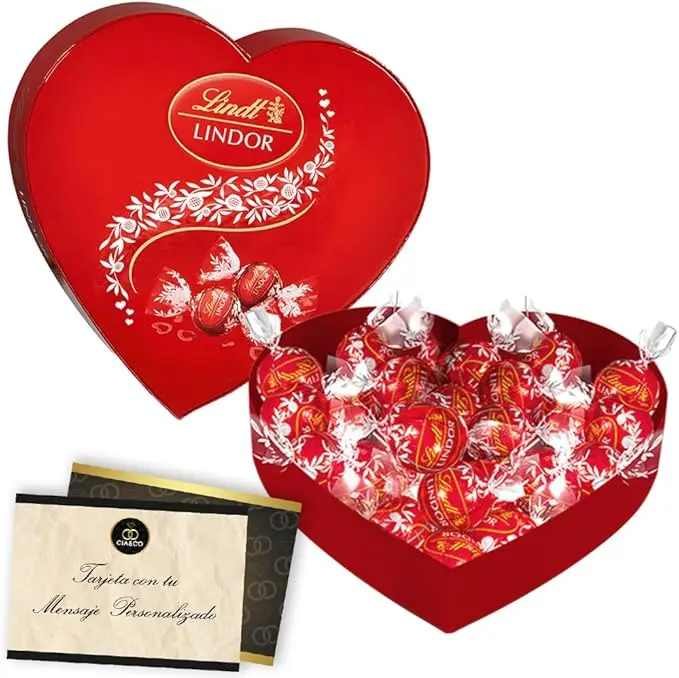 Corazón con 200g de Bombones LINDT LINDOR de Chocolate con Leche. Un regalo para San Valentín con tarjeta personalizada Cia&Co y caja reutilizable en forma de corazón.