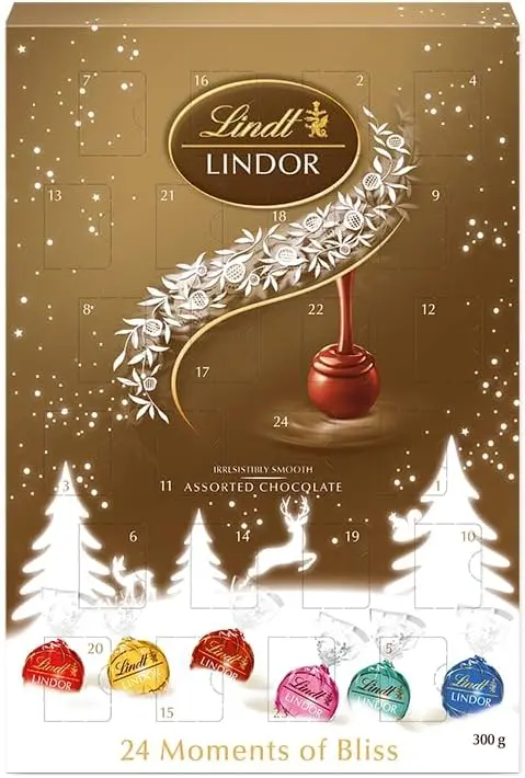 Gran Calendario de Adviento Lindt LINDOR con Tarjeta Cia&Co, 300g de bombones surtidos. Un regalo premium con 24 sorpresas de chocolate con corazón cremoso para Navidad.