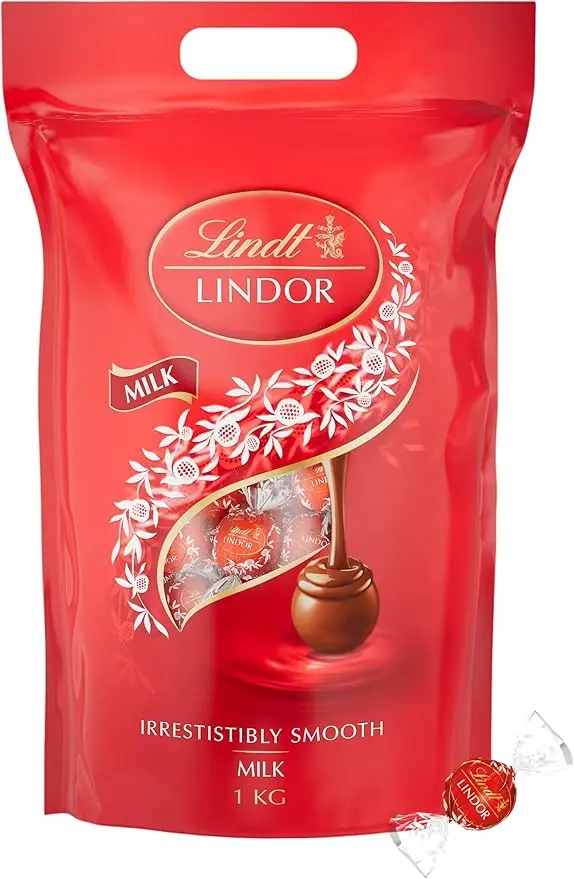 Lindt LINDOR Bombones de Chocolate con Leche, Bolsa de 1kg (Aprox. 80 bolas). Tu reserva personal de felicidad con el bombón más cremoso, perfecto para darte un capricho cada día.