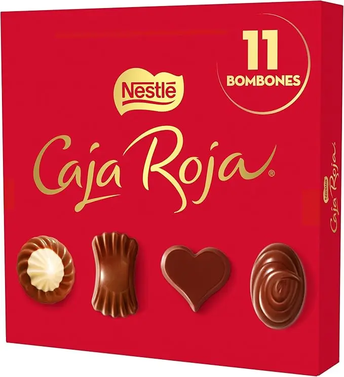 Nestlé Caja Roja, el surtido de 11 bombones de chocolate con leche, negro y blanco en estuche de 100g. Un regalo clásico con aromas 100% naturales y cacao sostenible.