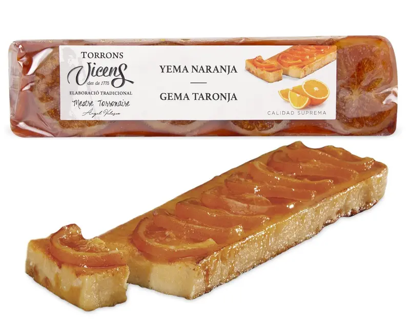 Torrons Vicens Turrón de Yema a la Naranja, 300g. Turrón artesanal especial que combina la cremosidad de la yema confitada con el toque cítrico de la naranja.